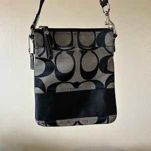 Crossbody black and gray coach purse with signature coach pattern